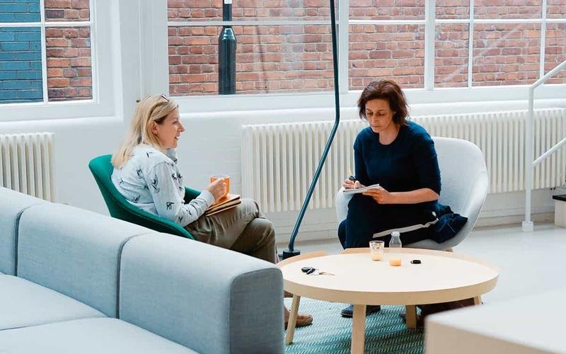 An advisor and a client talking through finances together